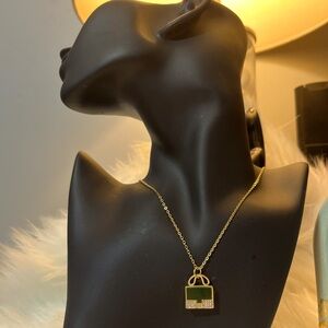 Elegant Gold and Green Pendant Necklace
Stainless Steel